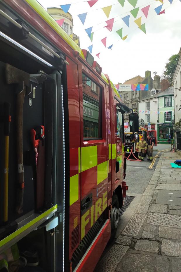 Falmouth Packet: Fire crews are blocking traffic on Market Strand in Falmouth. Picture: Sophie Sweatman