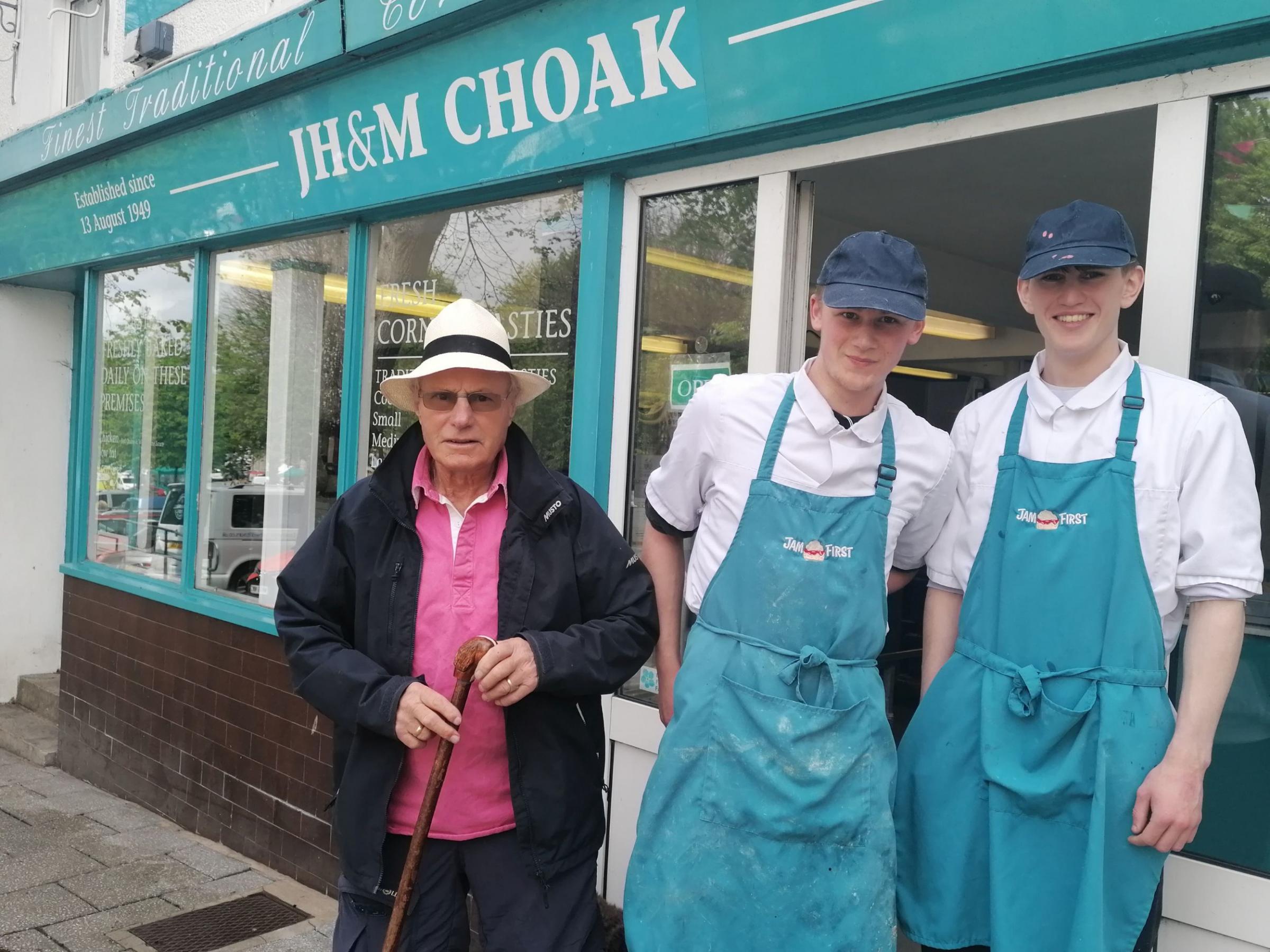 Charlie Choak with Mason Baker and Liam Folks outside the shop that is soon to close