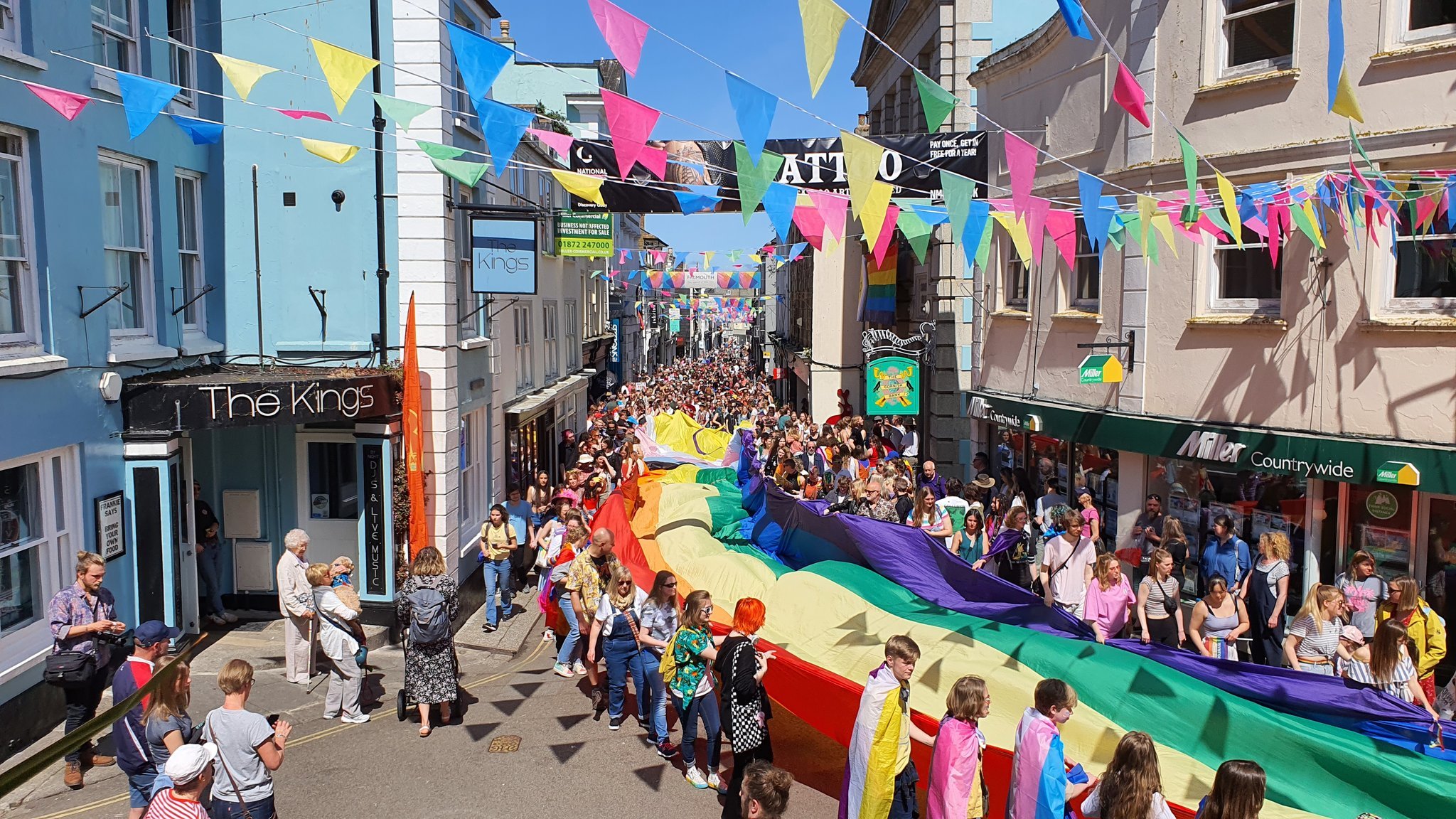 The first Pride march of the month, kicking off in Falmouth with the worlds largest Pride march flag. The march started at the Prince of Wales Pier, went through the centre of town and ended at Events Square. 7th May 2022.