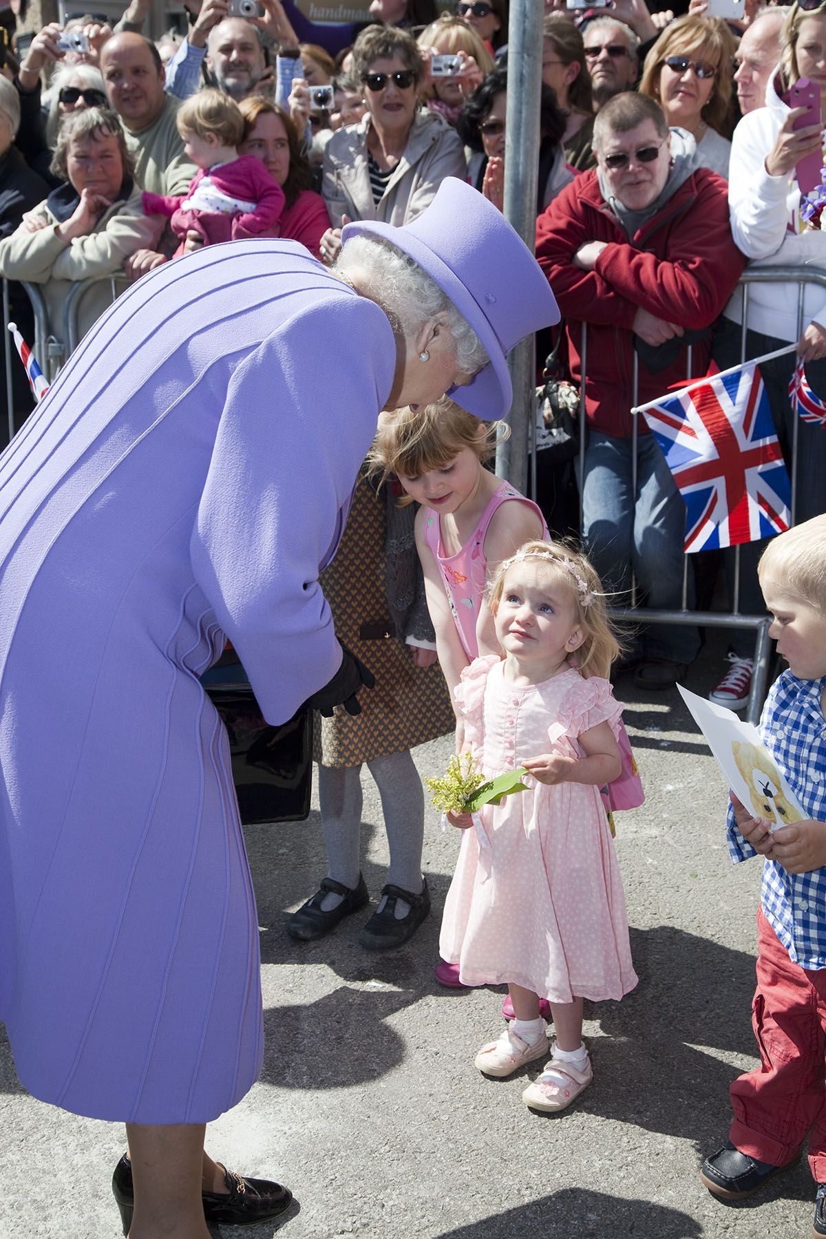 Reluctant to hand over her flowers - a little girl at St Ives presented to the Queen in 2013 Picture: Phil Monckton