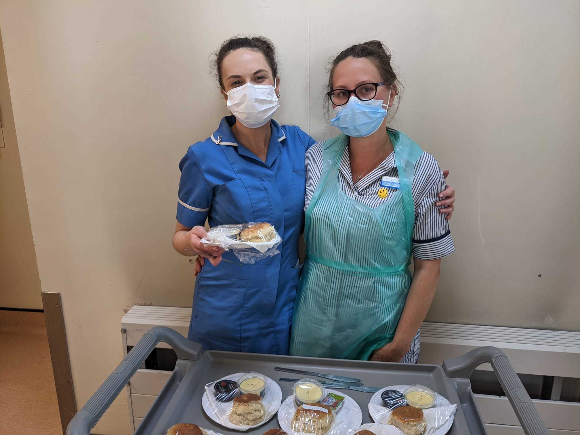 Staff Nurse Byrony Tresidder with GSA Amy Johnson with cream teas for patients and their visitors. Photo: Kate Lockett