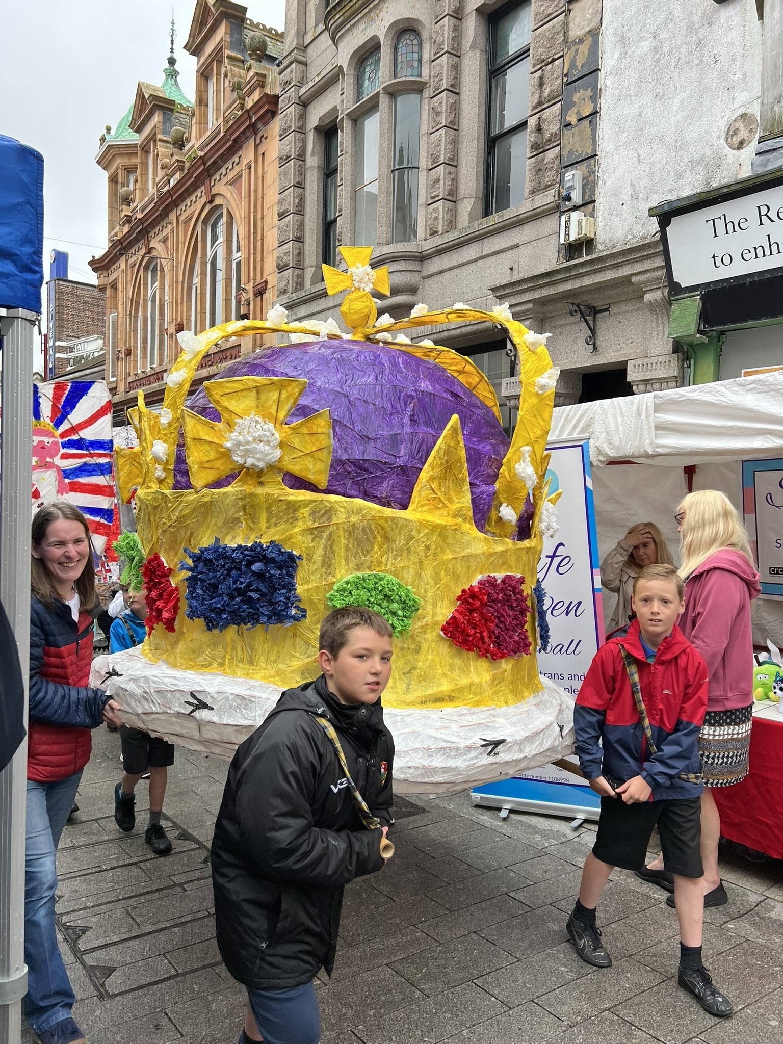 A giant papier mache crown is carried through town Picture: Pauline Giles
