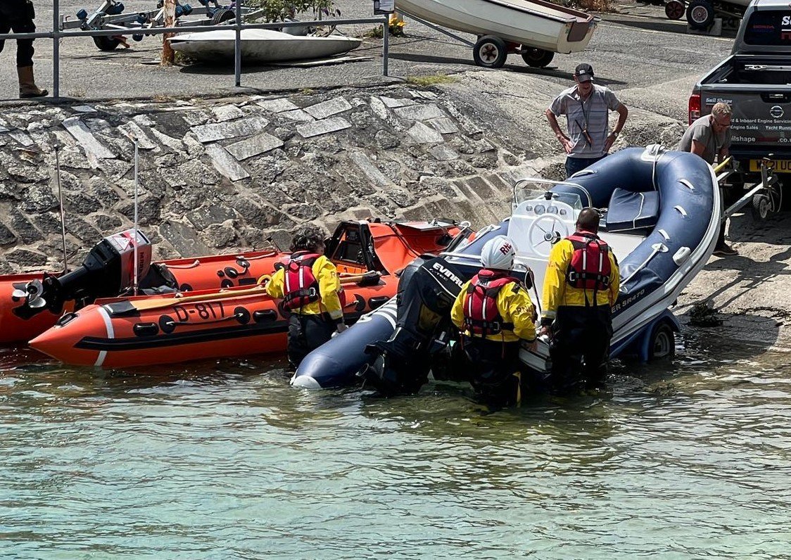 The inshore lifeboat brought the damaged rib into harbour  Picture: Fowey RNLI