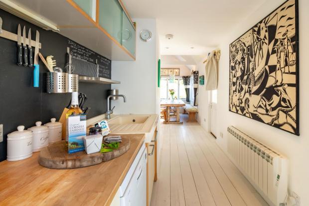 Falmouth Packet: Inside the kitchen of the property Picture: Lillicrap Chilcott / SWNS