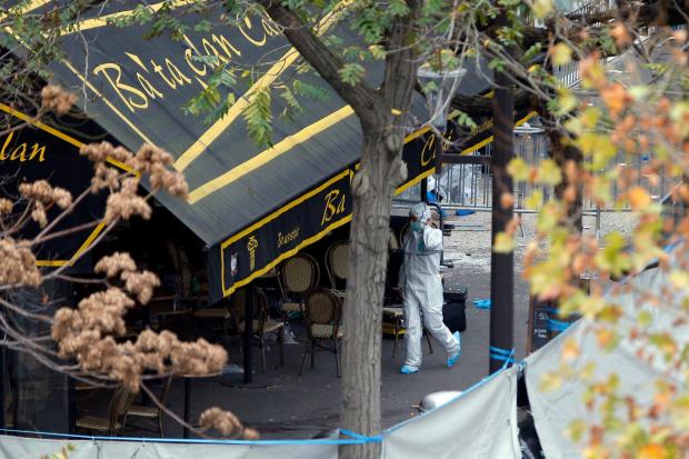 An investigator works outside the Bataclan concert hall
