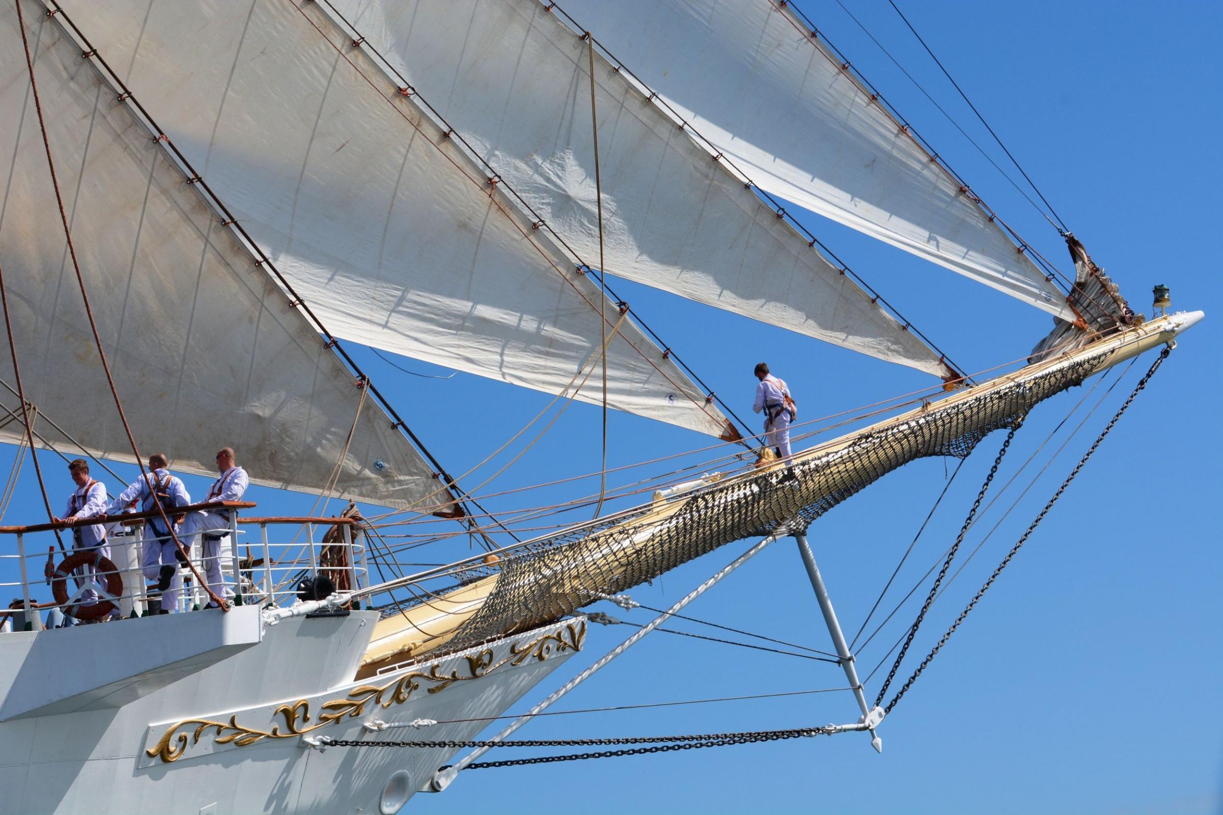 Unfurling the sails on Dar Mlodziezy tall ship