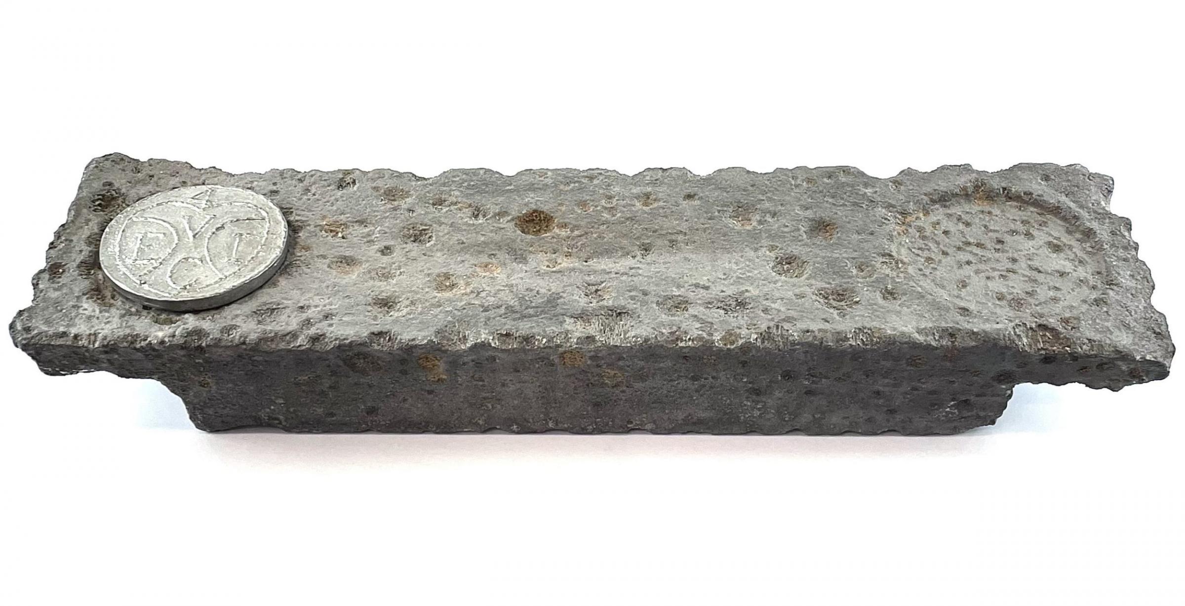 The ingot recovered from the wreck of the HMS Abergavenny Picture: David Lay Auctions/PA
