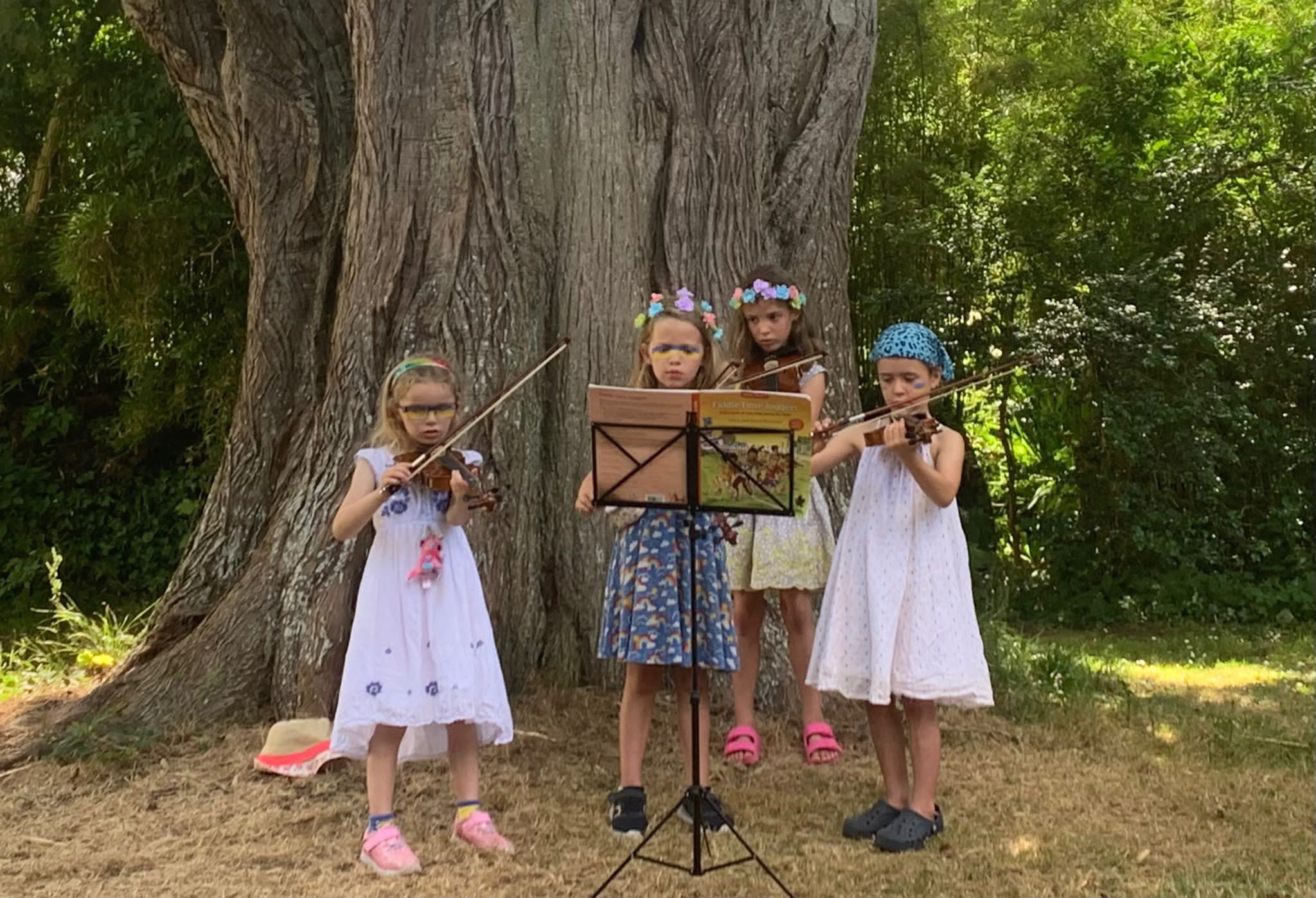 A violin quartet of Ettie, Bella, Wynnie and Darcey, all aged six