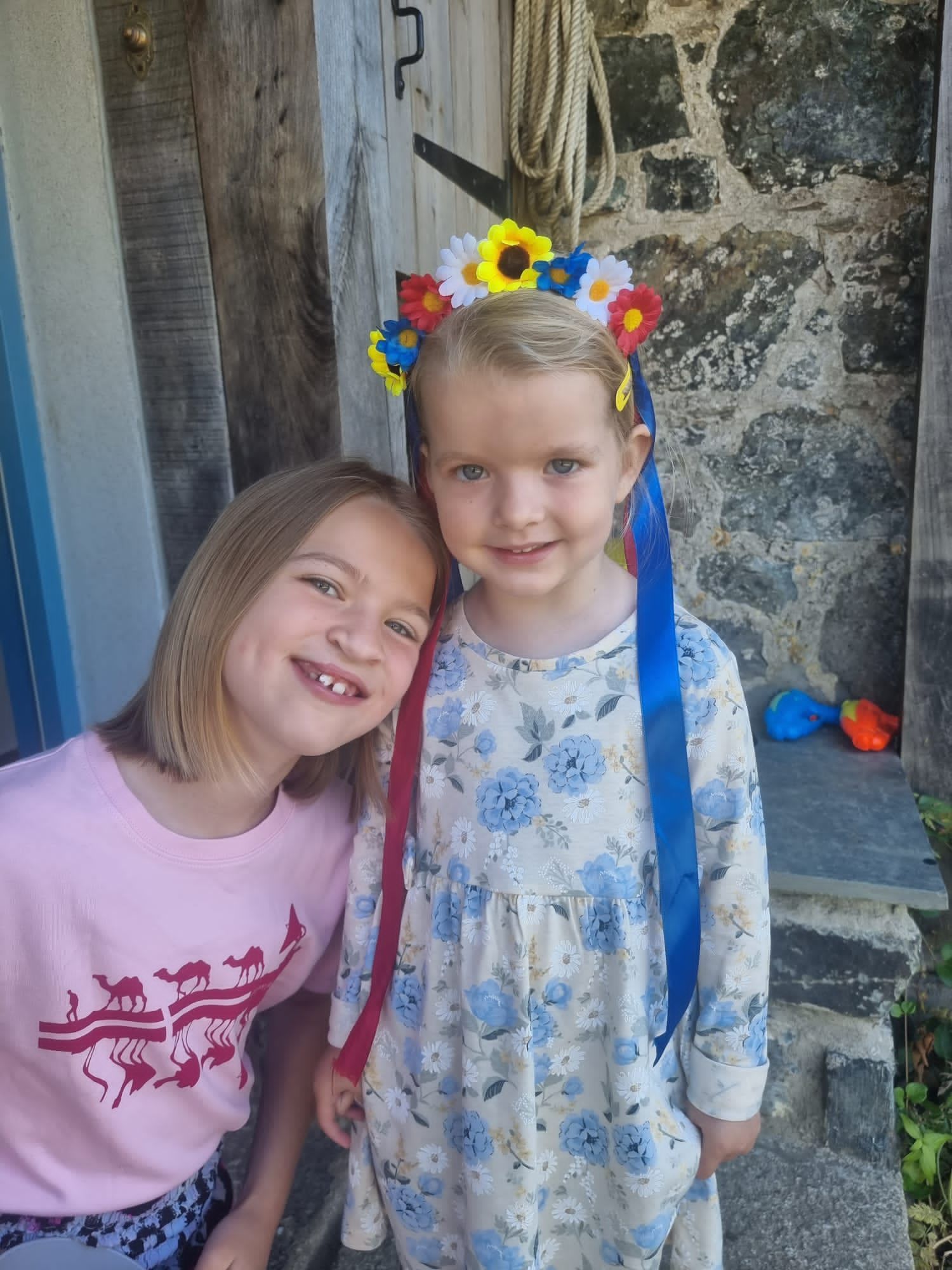 Clover, aged nine, and Pip, four, with the headband they crafted