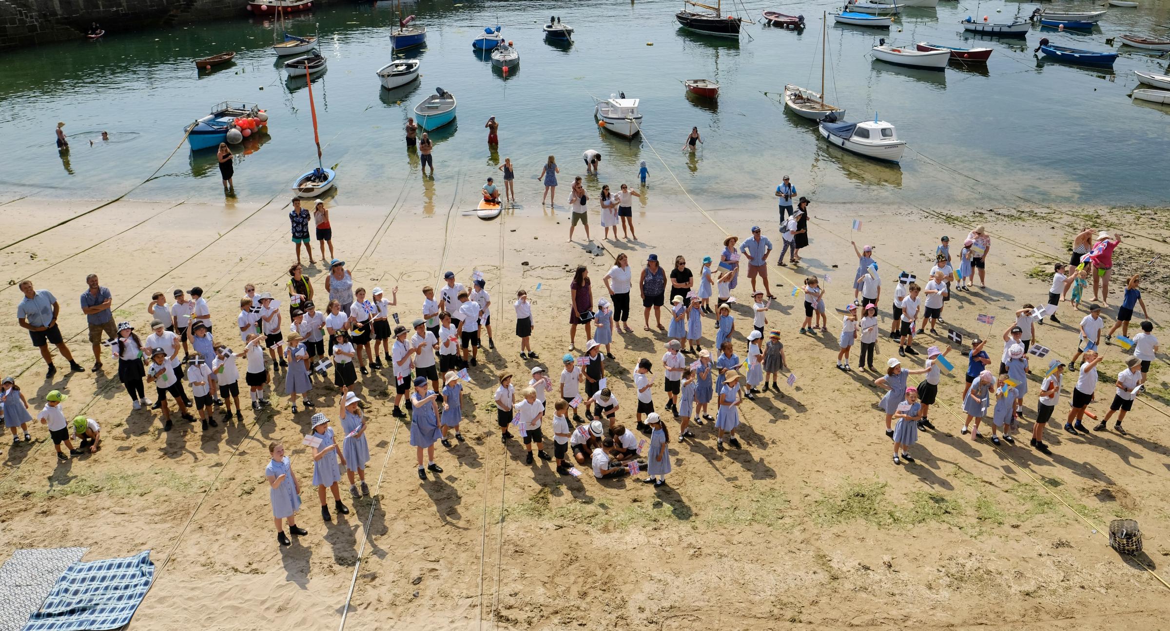 Pupils of Mousehole School wait on the beach for the royals Picture: Greg Martin / Cornwall Live