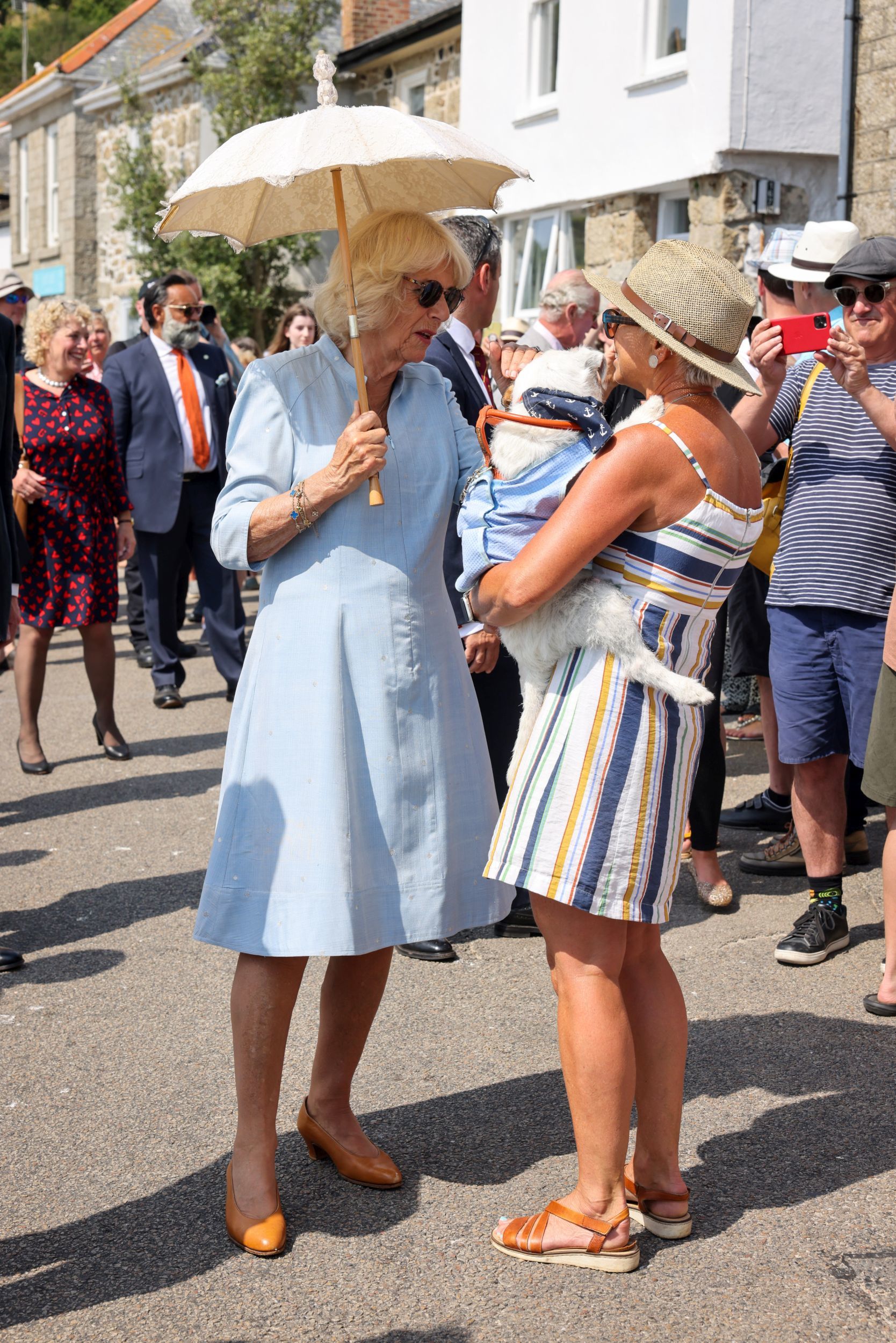 The Duchess of Cornwall kept herself covered with a parasol in the warm sunshine Picture: Greg Martin / Cornwall Live
