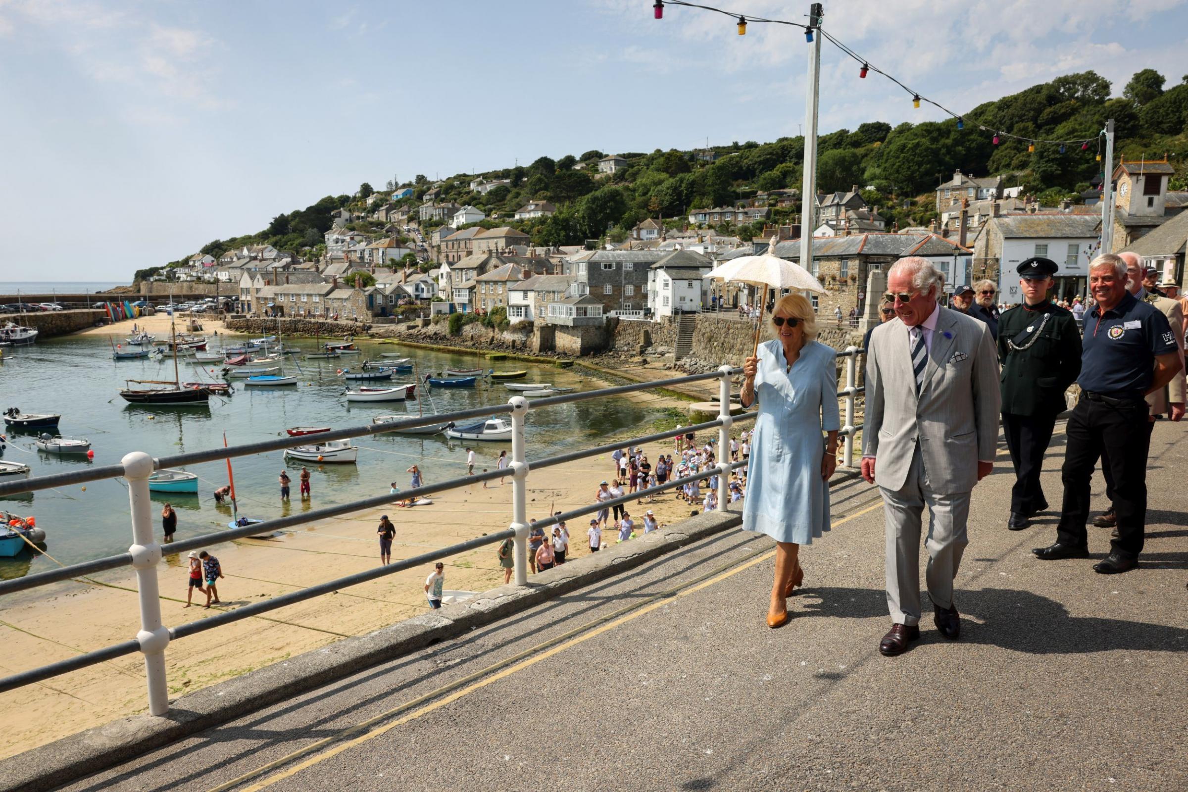 The couple take a walk along Mousehole Harbour Picture: Greg Martin / Cornwall Live
