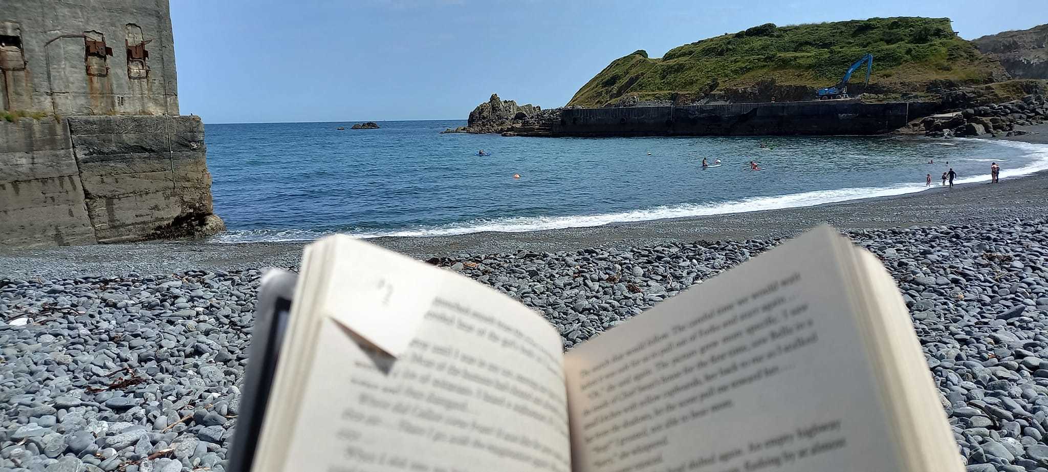 A book, the sound of waves and perfect views! What more could you want from a day at the beach, by Jo Thornhill