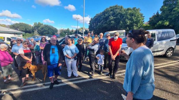 Falmouth Packet: Cllr Tamsyn Widdon spoke to campaigners who gathered in the Commercial Road car park in Penryn