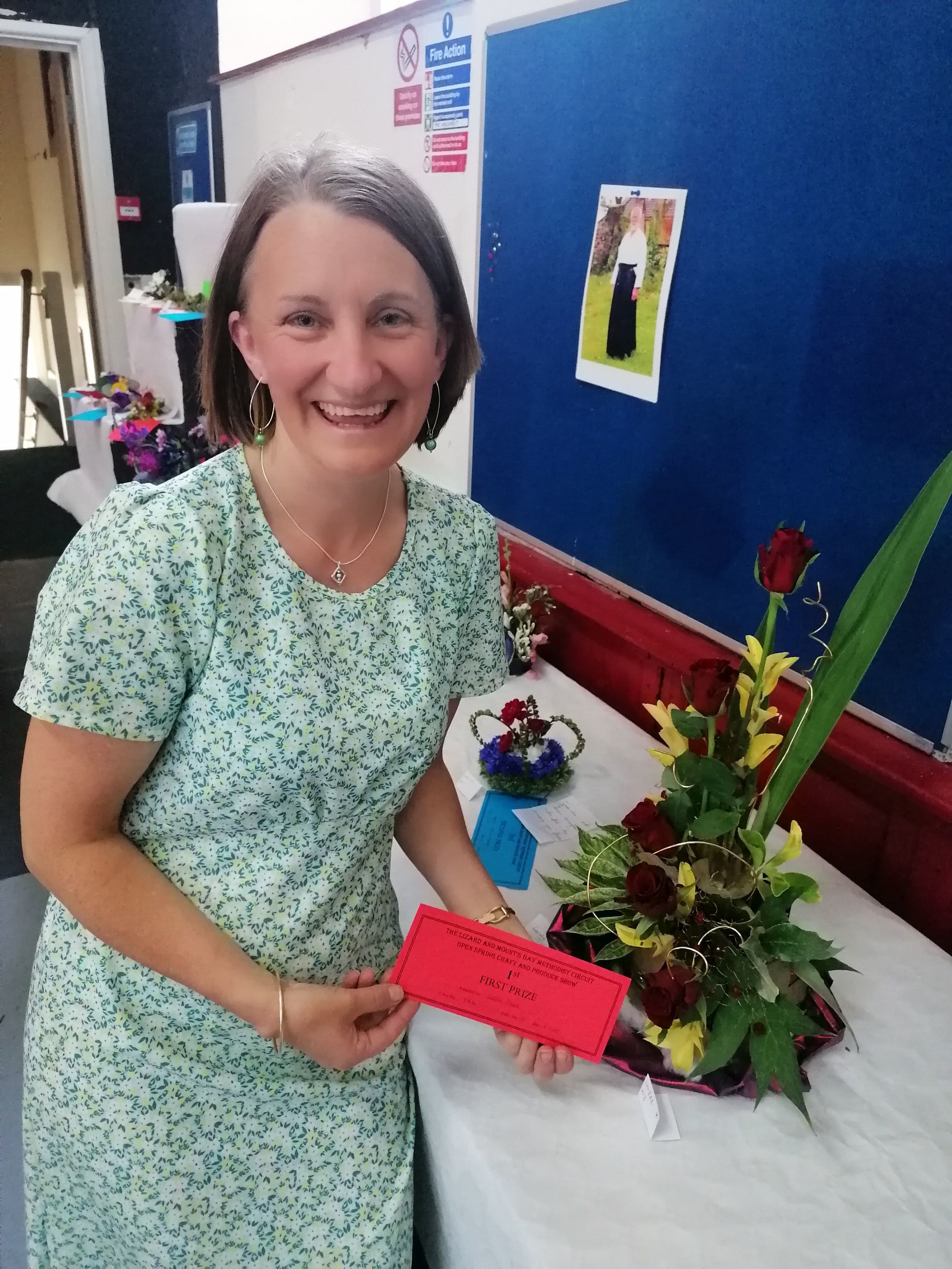 Sarah Reed with one of her flower arrangements that helped her win most points in floral art
