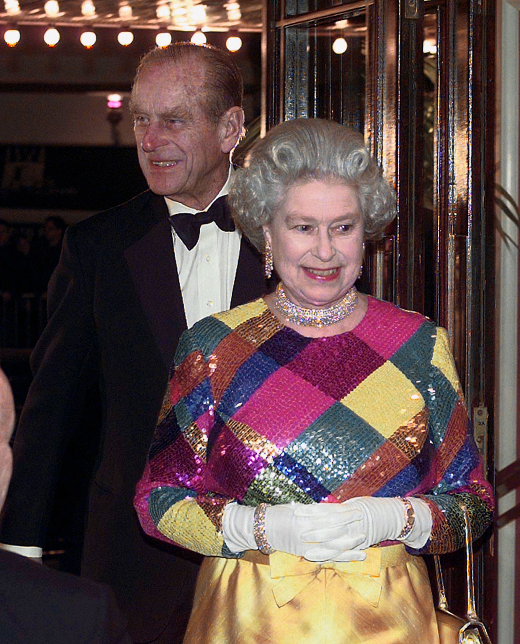 The Queen in her multi-coloured evening gown at the 1999 Royal Variety Performance in Birmingham Picture: David Jones/PA