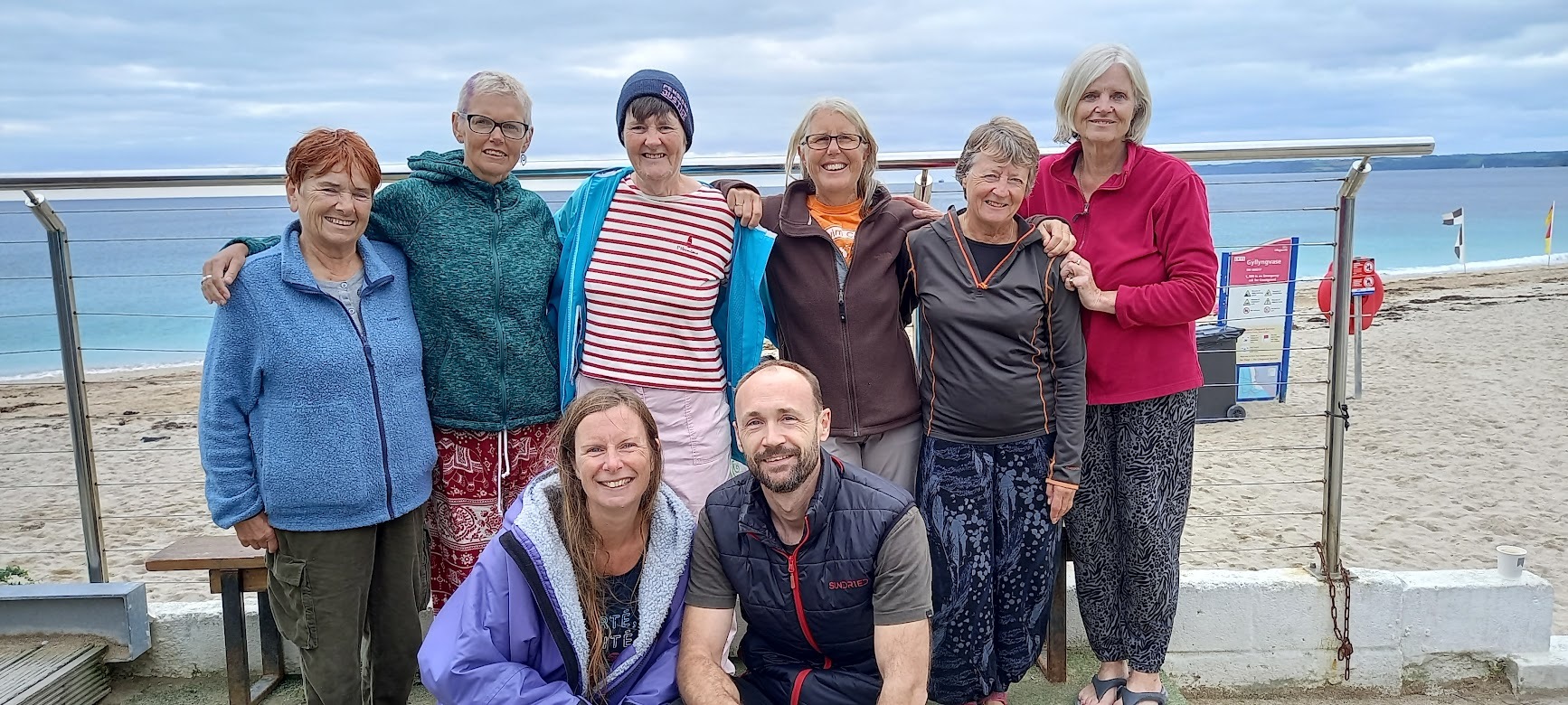 Jo Curd with her husband and members of her exercise group on Gylly Beach