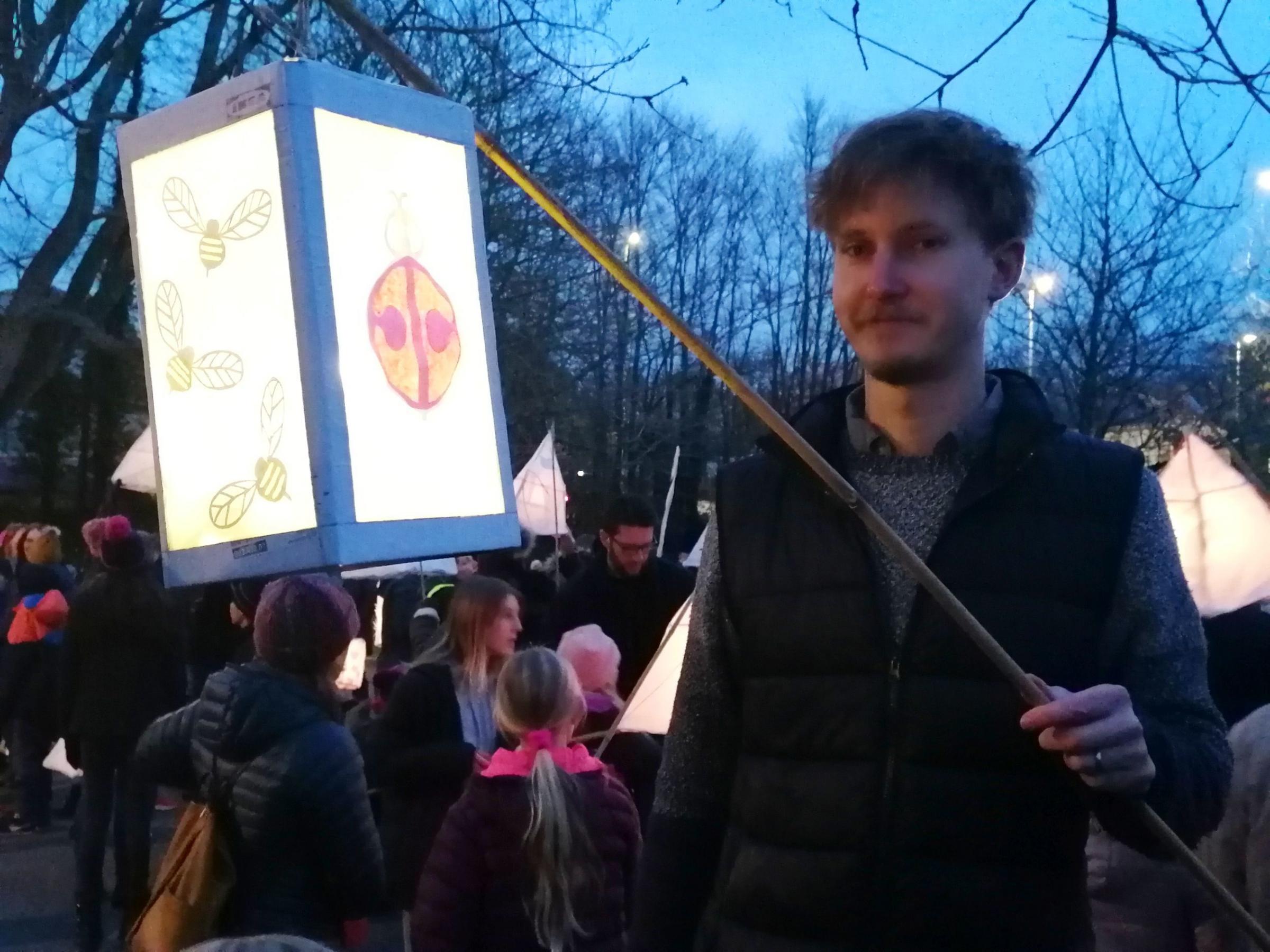 Simon holds a lantern made by his daughter Matilda, who was sadly unwell and unable to attend