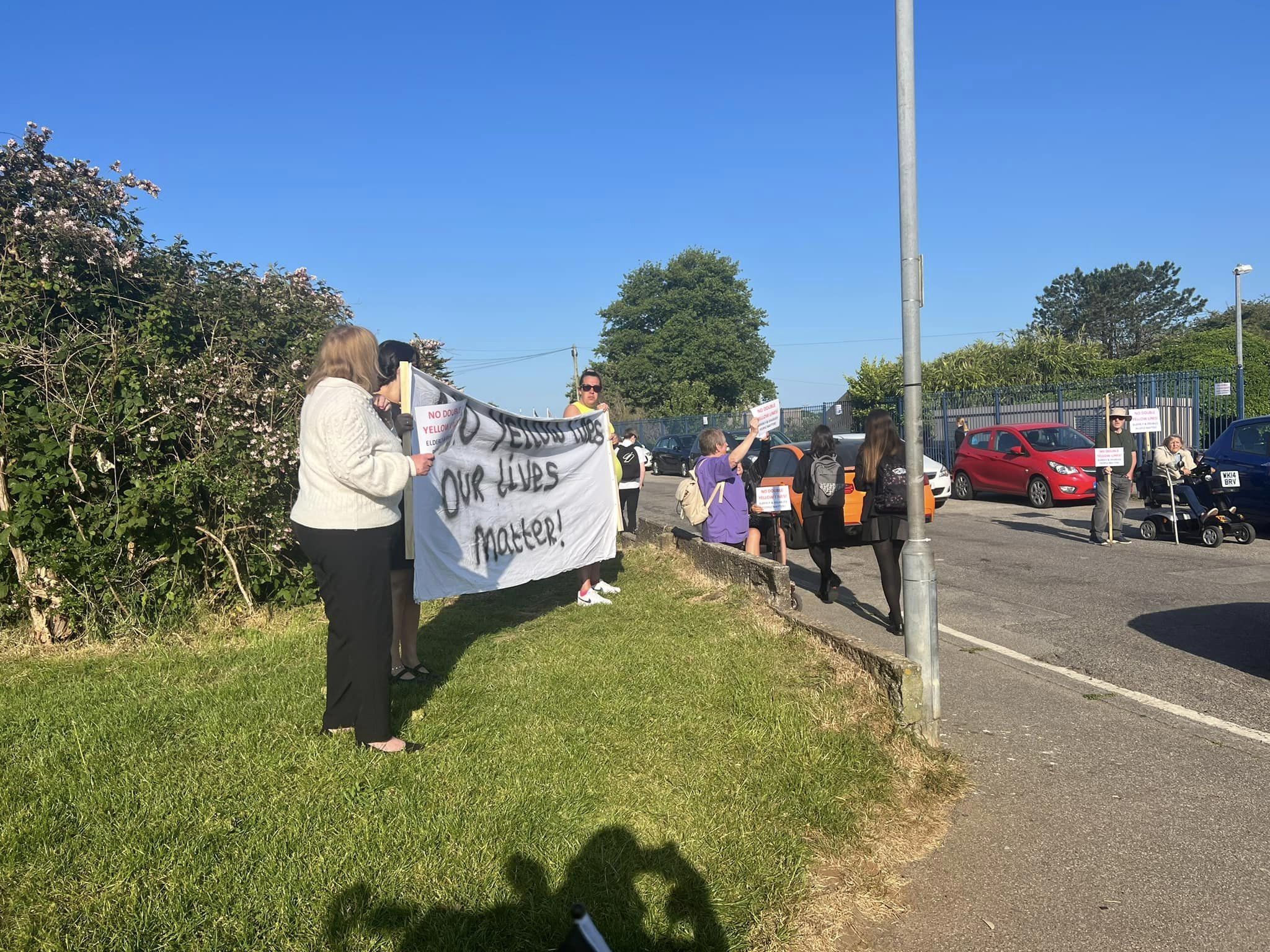 Residents of Cranberry Road protest the mooted traffic-calming measures outside Camborne Science & International Academy 
