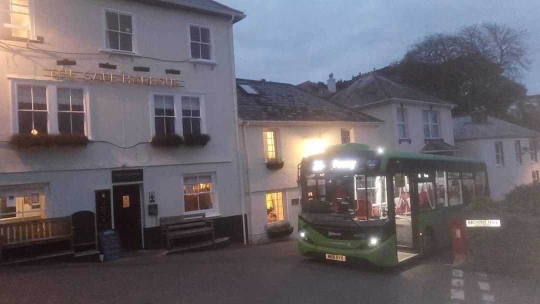 A bus picks up passengers at Safe Harbour - there is huge concern in Fowey at its possible loss