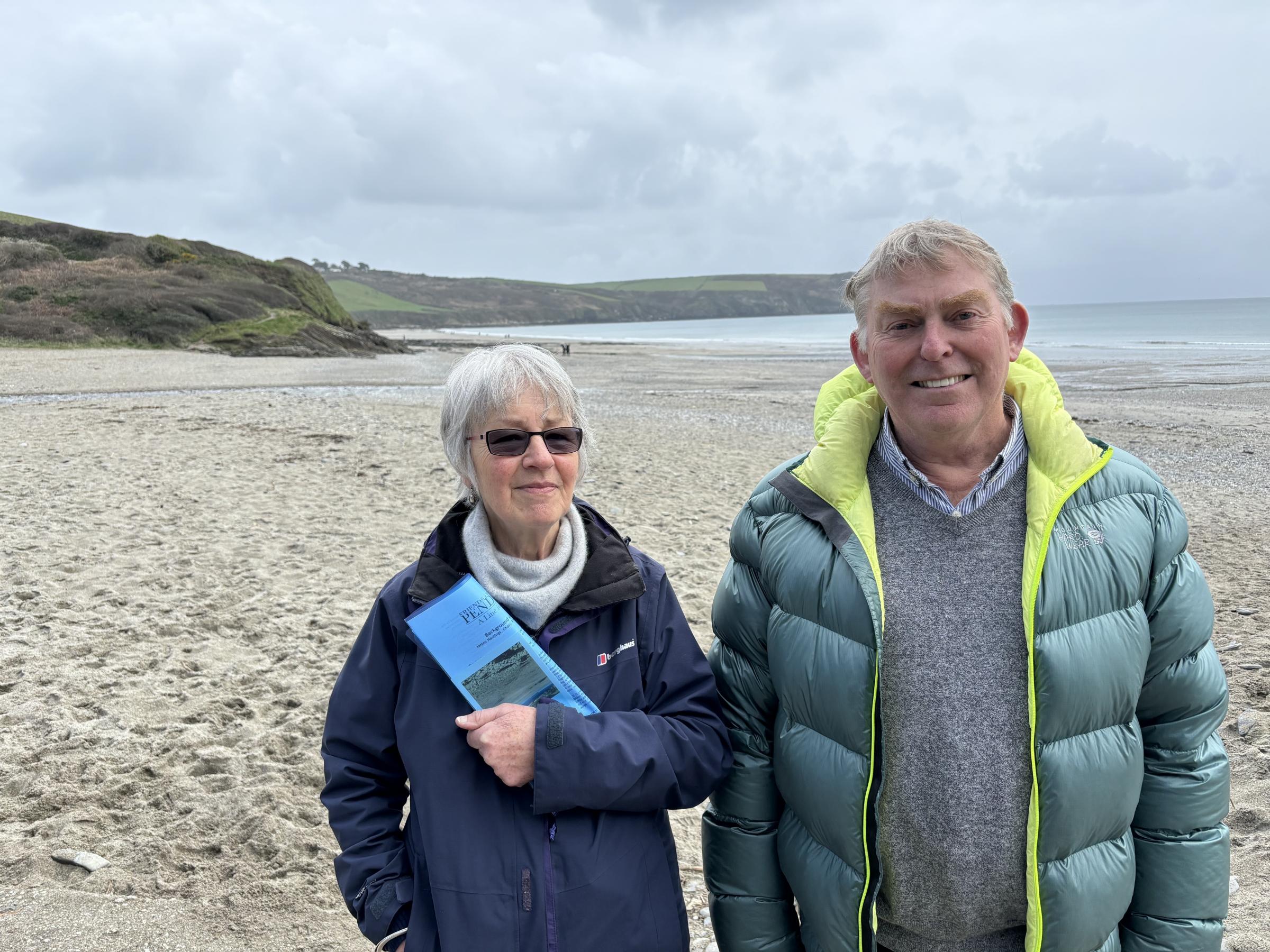Simon Fielder and Helen Hastings, of the Friends of Pendower Beach, on the beach they want to see remain unspoiled (Pic: Lee Trewhela / LDRS)