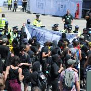 Kill The Bill protestors confront the police outside the Maritime Museum Media centre