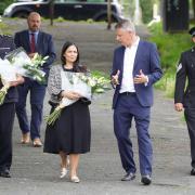 Home Secretary Priti Patel joins Devon and Cornwall Police chief constable Shaun Sawyer and local Labour MP Luke Pollard to lay flowers in Plymouth (Ben Birchall/PA)