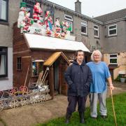 Roger and his son Ryan at the Christmas light display which has been banned over health and safety fears   Picture: James Dadzitis / SWNS