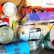 Penzance mayor Jonathan How (inset) has donated 50 Christmas food boxes