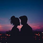 The shadows of a couple looking at each other over the skyline. Credit: Canva