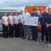 The Cornish Cottages team and owner Peter Collins present a cheque to Andrew Putt, Dan Atkinson, Ned Nuzum and John Harris from the Lizard Lifeboat.