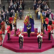 Man arrested after rushing towards Queen's coffin during lying in state.