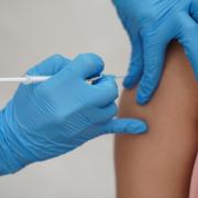 A person receiving a dose of Covid-19 vaccine