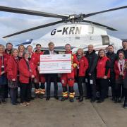 Richard Madeley presents a cheque to crew and staff of Cornwall Air Ambulance