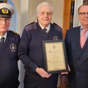 NCI Nare Point Watchkeeper Len Jepp receives his Cornwall High Sheriff's Award from Andrew Williams, witnessed by station manager Don Garman