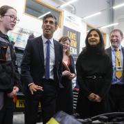 The PM and party talk engines with a motor vehicle student