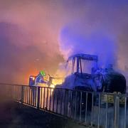 The fire engulfing the loader spread fast through the barn