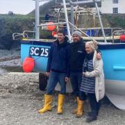 Callum Hardwick and Brett Jose with their new boat in Cadgwith