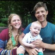 Kat Burton, with husband Chris and son Saxon, is running the London Marathon for a charity close to her heart