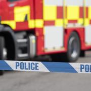 Stock image of a fire engine and police tape