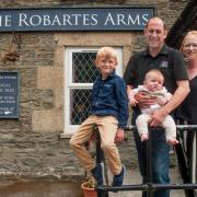 The Hodge family outside their new pub