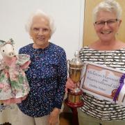 Pauline Eddy with her 'best in show' choice, a fabric pig made by Cynthia Treloar at last year's show