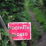 A sign warning of the footpath closure