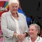 Kay Rundle from TrewCare with Judi Dench at Asda Penryn