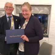 John Notley, Helston Rotary Club president, presents Amanda Boxer with the Paul Harris Fellowship Award