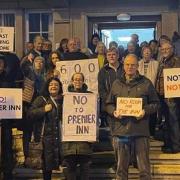 Protesters make their feelings known about the Premier Inn plans in the council chamber
