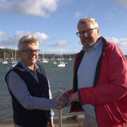 Nigel Sharp, Chairman of the Port of Falmouth Sailing Association presented retired Falmouth Harbour Master, Duncan Paul with a glass plaque to acknowledge the close relationship between the two organisations