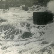 Heavy seas flooding the inner Harbour at Porthleven during extreme weather