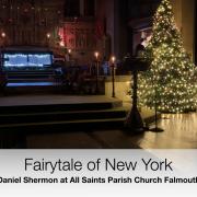 A still from the video of Daniel Shermon Director of Music playing Fairytale of New York at All Saints Church