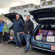 Members of A2B Taxi with three cars full of donations for DISC Newquay